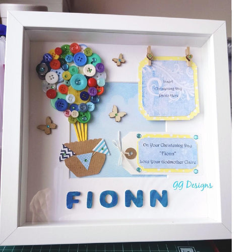 Personalised new baby gift. A super cute button hot air balloon loving handmade here in Co. Tipperary, Ireland. This colourful creation would be perfect in a nursery. Each balloon is individually made so no two are ever the same.    Beautifully presented in an Irish made box frame.    Suitable for a boy or girl.  A lovely christening gift.